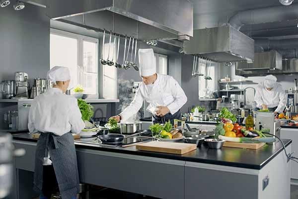Big and Glamorous Restaurant Busy Kitchen, Chefs and Cooks Worki